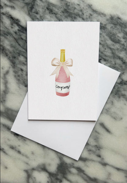 Pink champagne bottle card